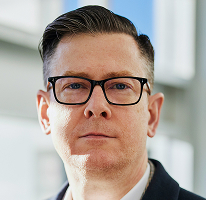 Alexander Hughes, CEO y directivo de una empresa de trading de criptomonedas, retrato